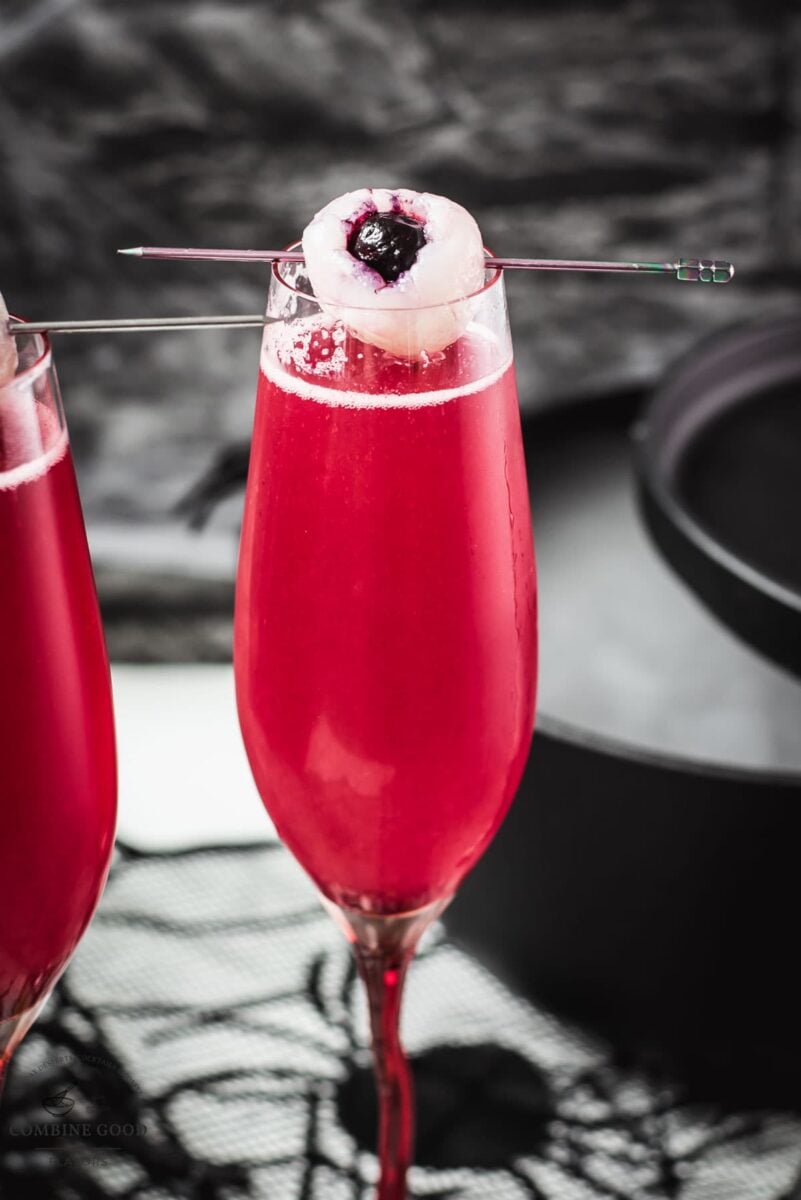 Spooky red Halloween cocktails, garnished with lychee eyeballs and served in a spooky location.