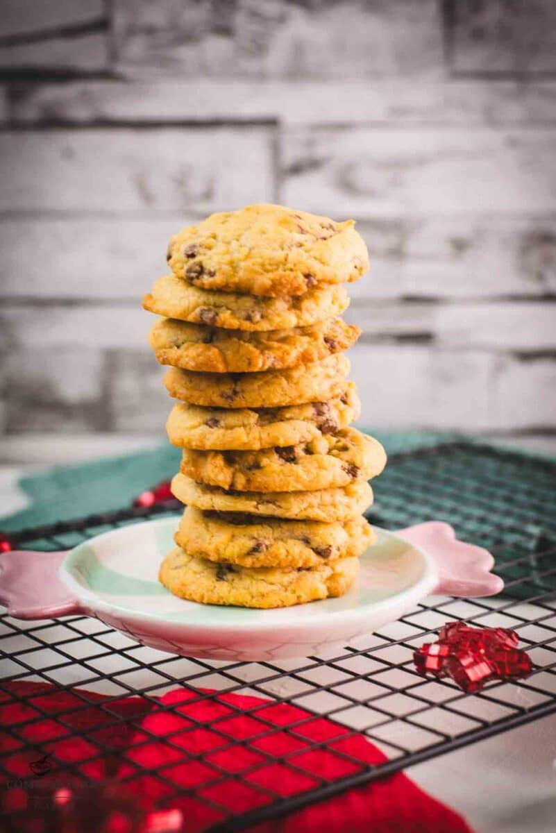 Chocolate chip cookies with vanilla pudding stacked on a festive candy-shaped plate.