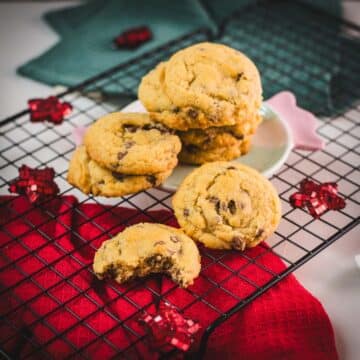 Chocolate chip cookies with vanilla pudding stacked on a festive candy-shaped plate.