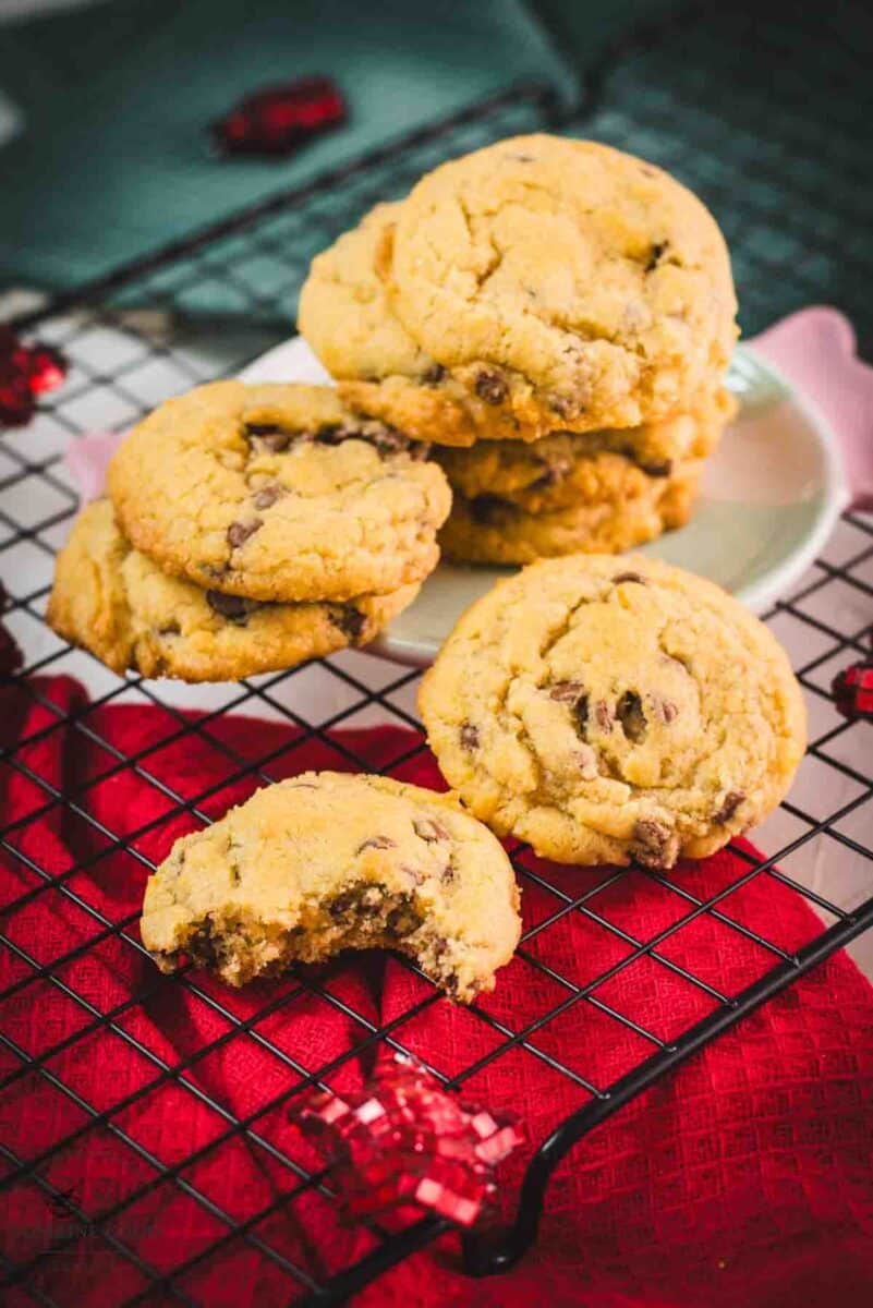 Chocolate chip cookies with vanilla pudding stacked on a festive candy-shaped plate.