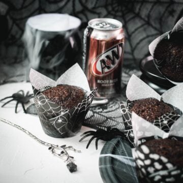 Chocolate root beer muffin in front of a bubbling cauldron and an A&W Root Beer can