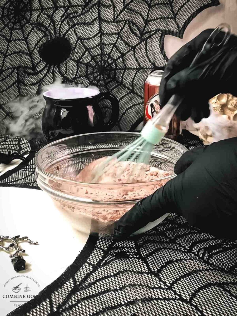 Whisking flour and cocoa mixture for Halloween chocolate muffins