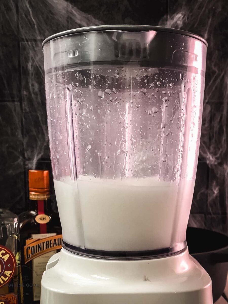 Bright green frozen margarita blended until thick and slushy
