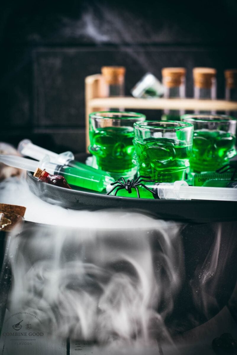 Halloween Jello shot syringes displayed with dry ice smoke