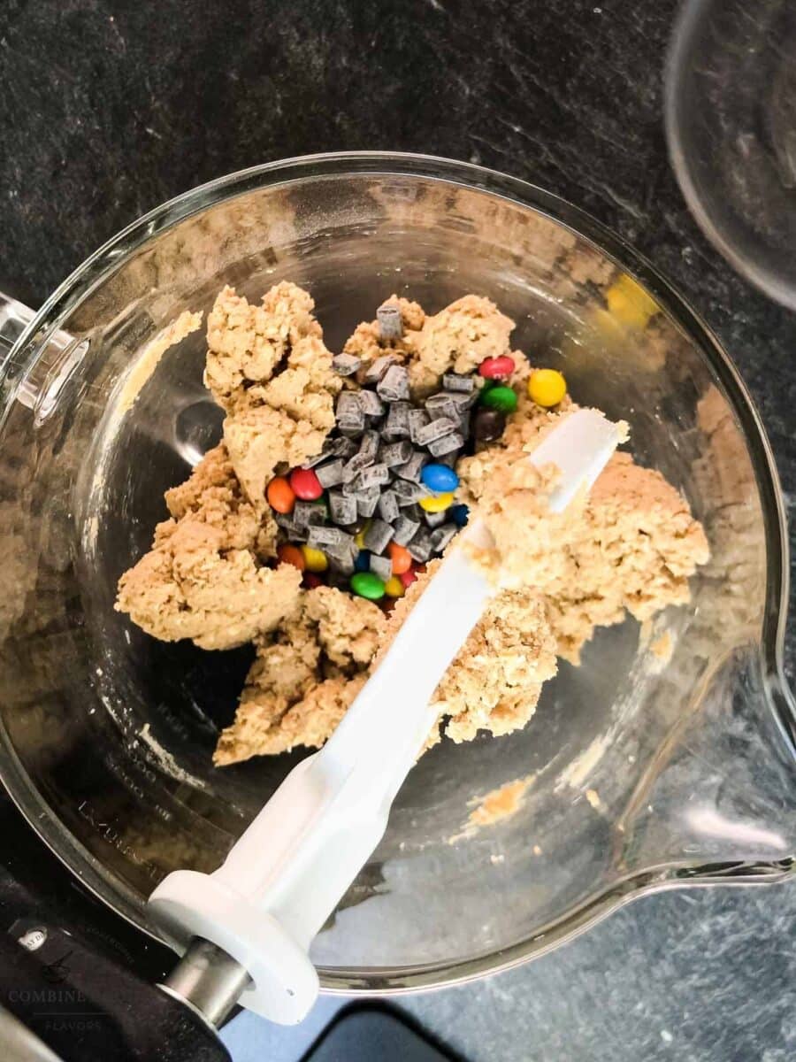 Chocolate chips and colorful M&M’s added to oatmeal cookie dough.
