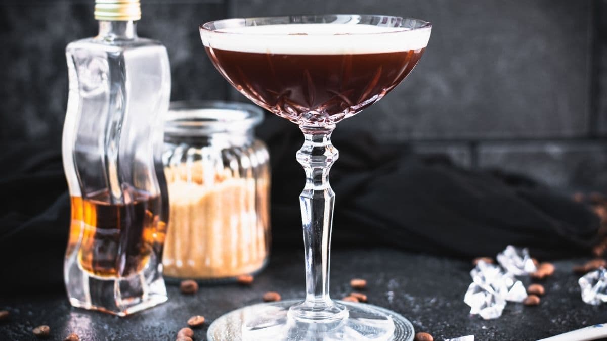 Brown sugar espresso martini placed on mirrored coaster.