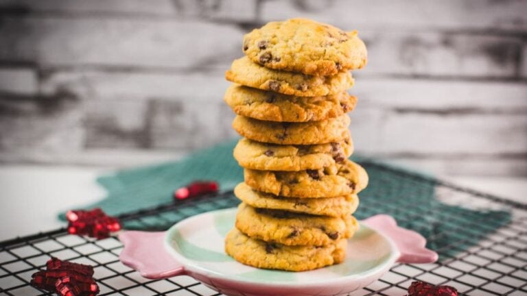 Chocolate chip cookies with vanilla pudding stacked on a festive candy-shaped plate.