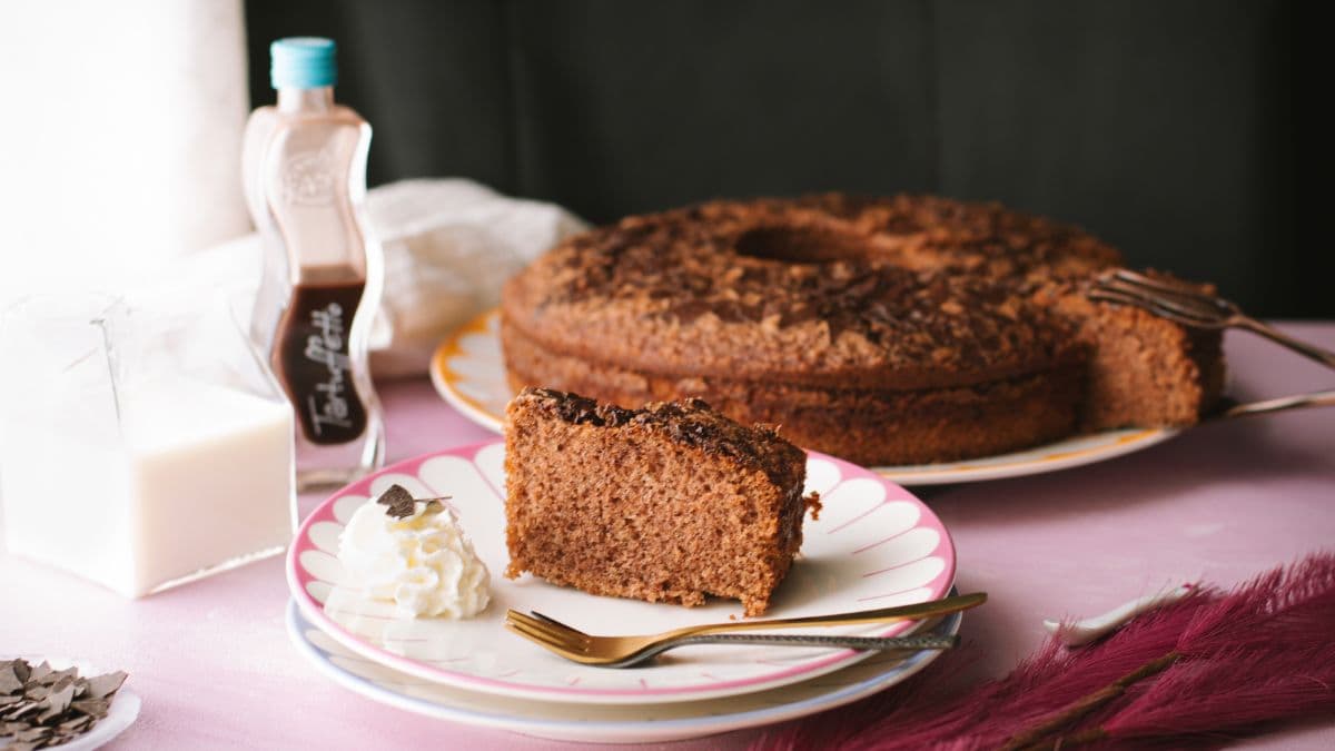 Fluffy chocolate cum cake with potato starch and chocolate rum liqueur. A slice placed on a beautiful, colorful plate.