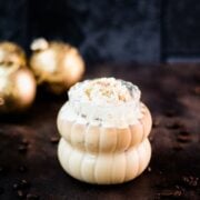 Delicious iced eggnog latte, garnished with heavy cream and dusted with ground cinnamon.