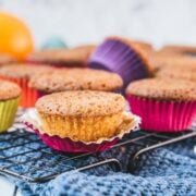 Gorgeous orange muffins placed on cooling rack.