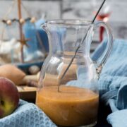 Bellini ready peach puree in a glass jug.