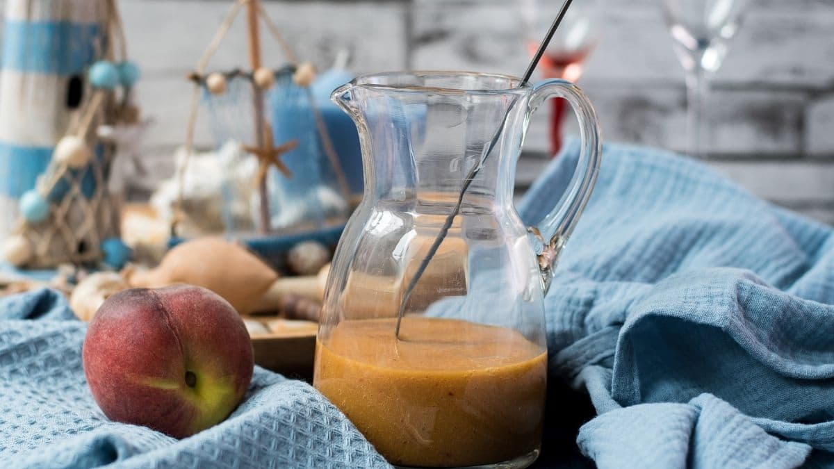 Bellini ready peach puree in a glass jug.