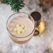 Divine rum alexander cocktail, garnished with a white chocolate snowflake.