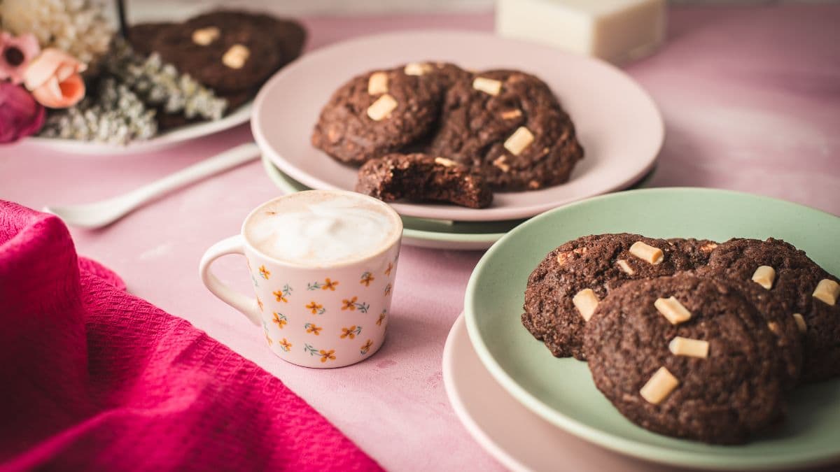 Divine white chocolate chip cookies with an incredible dark chocolate dough. Placed on pink-green plates.